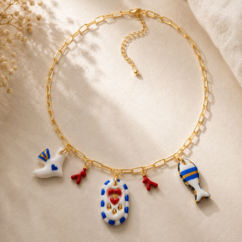 Mediterranean porcelain charm necklace with dove, coral and fish charms