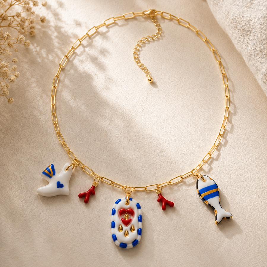 Mediterranean porcelain charm necklace with dove, coral and fish charms
