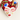 Hand holding a burgundy floral portrait porcelain heart earring for scale.