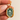 Close-up of raised green botanical relief on pale porcelain with gold edge