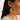 Handmade Porcelain Bird Earrings – Floral Ceramic Dangle Earrings worn by a model. This image highlights the Porcelain Bird Earrings with Hand Painted Floral designs, showcasing their playful and artistic touch.