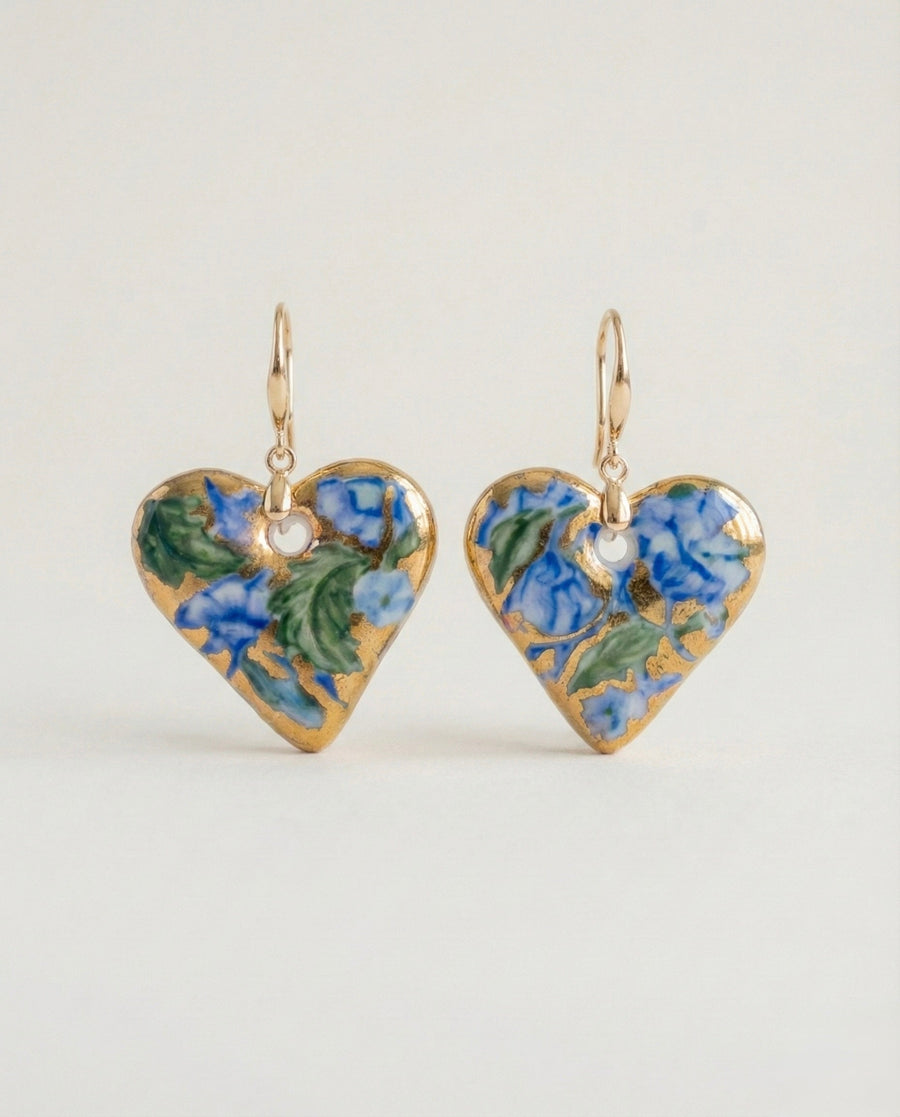 Close-up of hand-painted Delft blue porcelain floral earrings
