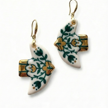 Pair of earrings with floral design on a white background