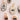 Oval-shaped ceramic pendants featuring hand-painted black and gold designs including insects, eyes and hearts, each with a gold-toned jump ring