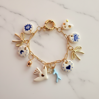 Flat lay of porcelain charm bracelet showing all charms