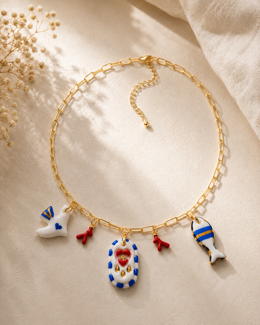 Mediterranean porcelain charm necklace with dove, coral and fish charms