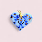 Real Gold Porcelain Heart Pendant by BitaJewells featuring handcrafted Delft-inspired design, showcasing a beautiful blue and gold-accented heart shape. This minimalist pendant is perfect as a Mother's Day gift or a statement piece in your art jewelry collection, combining a floral motif with a glossy finish, making it a unique addition to small batch jewelry lovers.