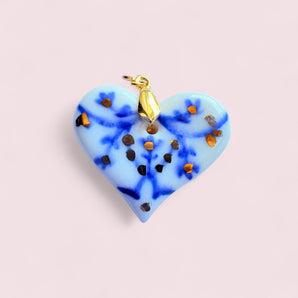 Real Gold Porcelain Heart Pendant by BitaJewells featuring handcrafted Delft-inspired design, showcasing a beautiful blue and gold-accented heart shape. This minimalist pendant is perfect as a Mother's Day gift or a statement piece in your art jewelry collection, combining a floral motif with a glossy finish, making it a unique addition to small batch jewelry lovers.