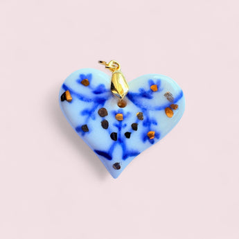 Real Gold Porcelain Heart Pendant by BitaJewells featuring handcrafted Delft-inspired design, showcasing a beautiful blue and gold-accented heart shape. This minimalist pendant is perfect as a Mother's Day gift or a statement piece in your art jewelry collection, combining a floral motif with a glossy finish, making it a unique addition to small batch jewelry lovers.