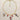 Gold paperclip chain necklace with hand-painted ceramic dove, coral, fish, and medallion charms, laid flat