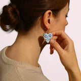A model showcasing BitaJewells Handmade Porcelain Face Design Shape earrings, highlighting their elegance and unique face design. Perfect Porcelain Earrings with unique face design for fashionable styling.