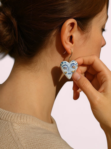 A model showcasing BitaJewells Handmade Porcelain Face Design Shape earrings, highlighting their elegance and unique face design. Perfect Porcelain Earrings with unique face design for fashionable styling.