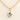 A gold paperclip chain necklace with an oval white pendant featuring a painted red and blue flower, displayed on a light beige background.