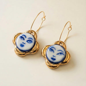 Cobalt moon face porcelain earrings with sculptural gold flowers and 22K gold lustre