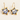 Pair of white porcelain star hoop earrings with hand-painted blue cat faces and gold lustre borders.