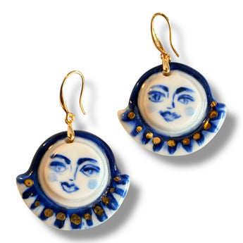 A close-up view of Celestial Gaze Porcelain Earrings emphasizing cobalt blue color and gold luster details, perfect unique statement earrings.