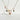 Porcelain charm necklace with clock and bow detail