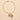 Porcelain heart pendant and hand-and-rose charm necklace worn, showing scale against skin