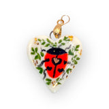 Handmade porcelain charm with a lady bug design