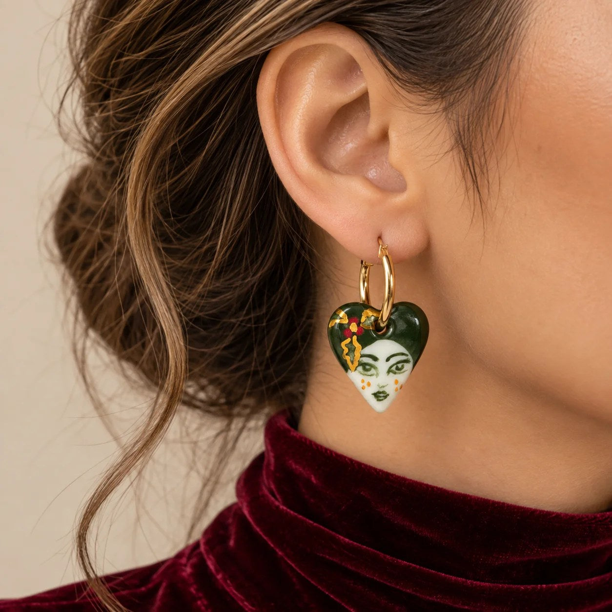 Portrait earrings styled with red velvet